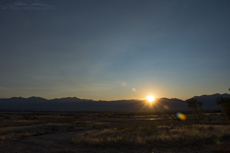Sun rising opposite the setting Harvest Moon, West Desert, Tooele County, Utah