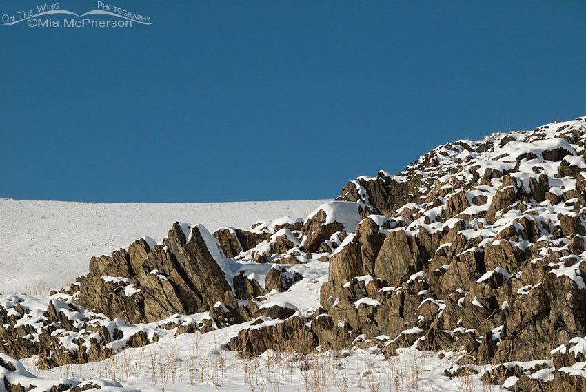 Farmington complex rocks under fresh snow on Antelope Island State Park in Davis County, Utah